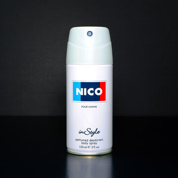 NICO perfumed body spray isolated on black background in this professional studio photograph showcasing essential grooming product design