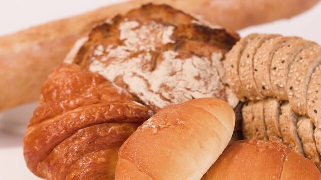 Assorted Fresh Bakery Products with Hand Selecting Sourdough and Multigrain Loaves