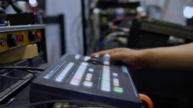 Television director switching live broadcast on video mixer
