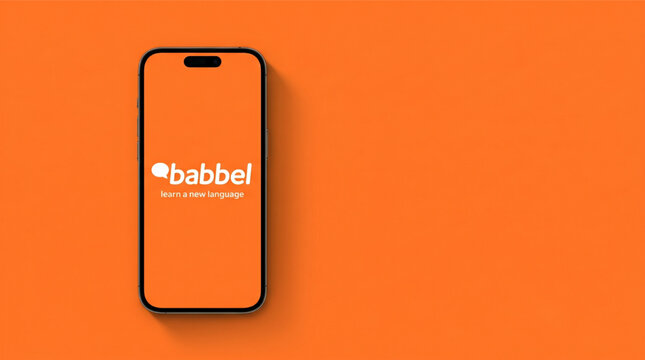 Babbel language learning app on smartphone iPhone screen with white brand logo and slogan learn a new language over flat orange background. Mobile education technology concept for digital study.