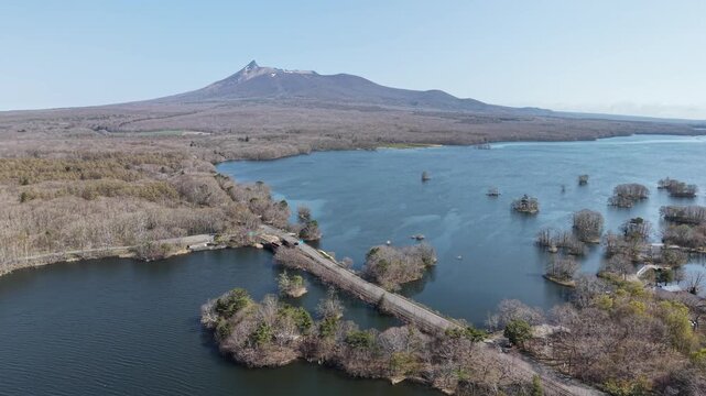 HOKKAIDO, JAPAN.Natural park with scenic lake and volcanic peaks April 26 2026