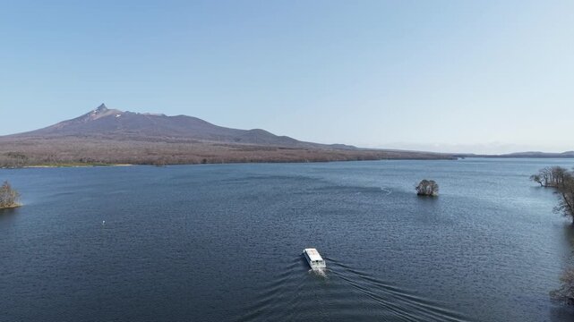 HOKKAIDO, JAPAN.Natural park with scenic lake and volcanic peaks April 26 2026