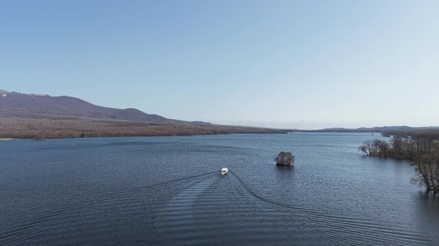 HOKKAIDO, JAPAN.Natural park with scenic lake and volcanic peaks April 26 2026