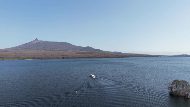 HOKKAIDO, JAPAN.Natural park with scenic lake and volcanic peaks April 26 2026