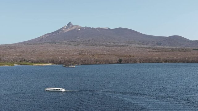 HOKKAIDO, JAPAN.Natural park with scenic lake and volcanic peaks April 26 2026