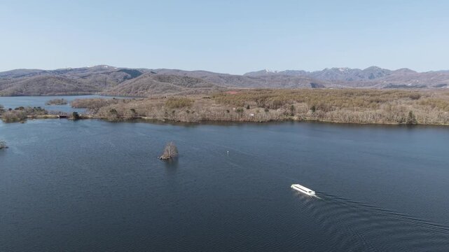HOKKAIDO, JAPAN.Natural park with scenic lake and volcanic peaks April 26 2026