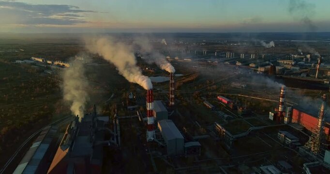 Metallurgical production smoking chimneys Top view of heavy industry plant. Environmental pollution. Steel factory. Aluminum production. Aerial 4K