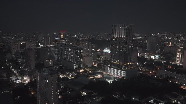 Aerial view of the illuminated Cebu City skyline at night with glowing skyscrapers and city lights Cebu City, Central Visayas, Philippines.