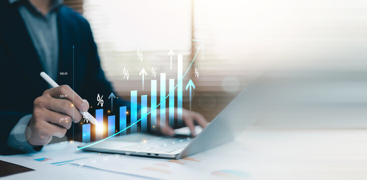 Business financial growth analysis with rising bar chart, percentage indicators and upward trend line. Professional investor using digital technology for investment strategy, profit growth, economic
