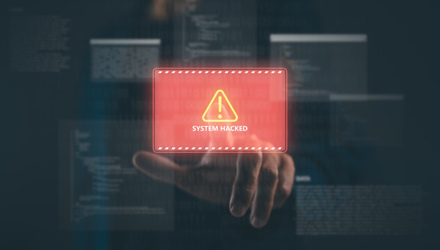 A hand interacts with a digital screen displaying a red warning message indicating a system has been hacked.
