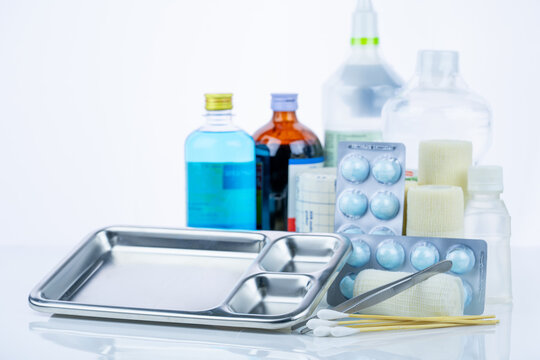 Medical equipment for treating infections. Wound care dressing set. Medical supplies for nurses. Conform bandage, forceps, cotton stick, alcohol. Sterile dressing materials. Healthcare equipment.