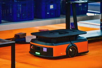 Autonomous mobile robot AMR navigating through modern smart warehouse floor.  © I Viewfinder