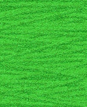 Lush Green Grass Field Texture, Top View. Close-up aerial view of vibrant green grass with a uniform, dense texture. Ideal for use as a natural background, wallpaper, or design element in sports, gard