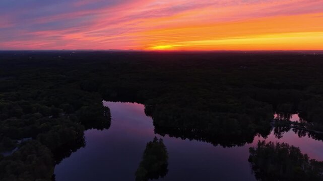 Bird's eye view during an epic sunset at Harold Parker State Forest, surrounded by nature and a dense pine tree forest, Andover, Massachusetts