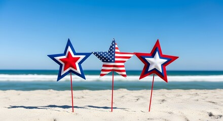 Labor Day Three decorative star shaped ornaments in red white and blue resting on a sandy beach against a bright blue sky for Labor Day