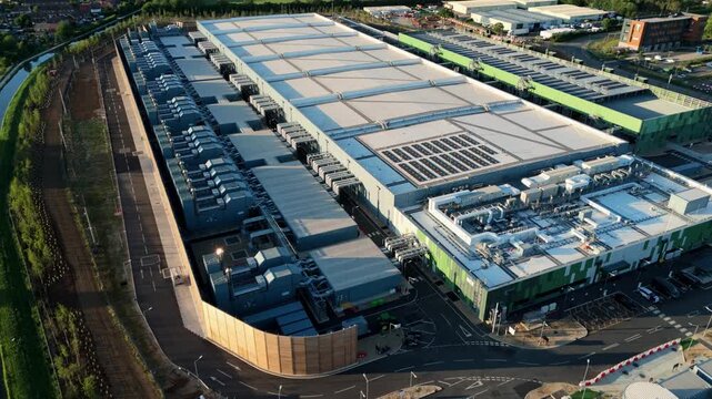 Aerial view of the Google Data Centre Waltham Cross with industrial cooling systems and solar panels, Cheshunt, England, United Kingdom.
