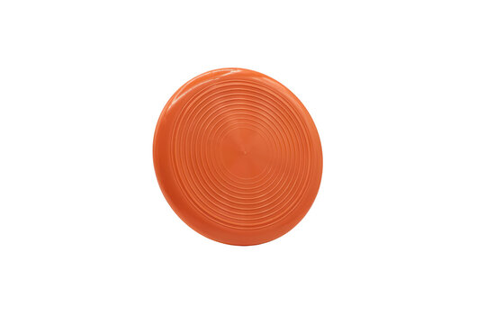 A bright orange plastic frisbee featuring concentric circular grooves on the surface isolated on a transparent background