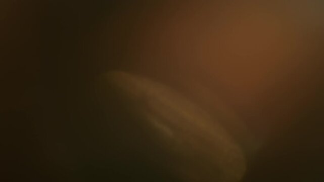 Real In-Camera Soft Bokeh Lens Flare with Orbs Light on Black Background. Use blend mode screen, add, overlay on footage for graphic texture. 4K.