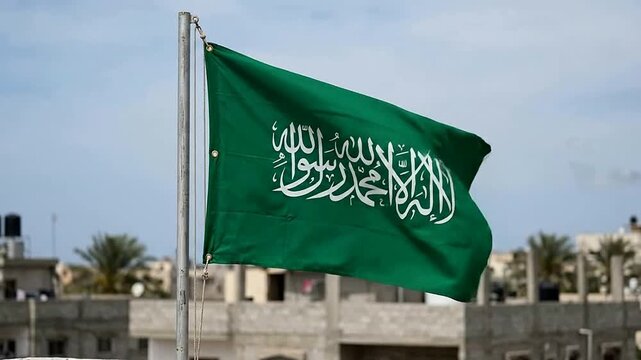Saudi Arabian Flag Flapping in Wind with Urban Background