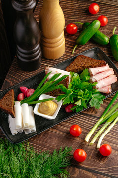 Eastern European appetizer platter with salo and mustard