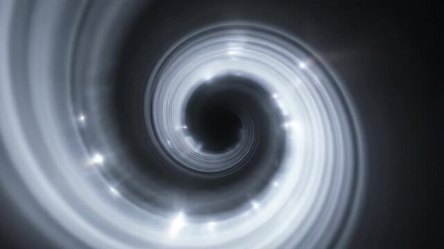 Spinning spiral with glowing lights on dark background, creating a luminous swirling pattern