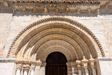 Architectural detail of the semicircular archivolts and decorated corbels at the 12th-century Romanesque portal of the Church of San Juan ante Portam Latinam in Arroyo de la Encomienda, Valladolid, Ca © Nandi Estévez