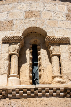 Architectural detail of a 12th-century Romanesque window with carved capitals at the Church of San Juan ante Portam Latinam in Arroyo de la Encomienda, Valladolid, Castilla y Leon, Spain