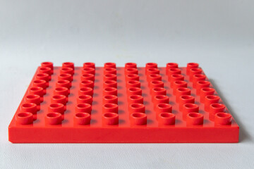 Fototapeta premium Front Perspective View Red Square lego duplo base plate toy block brick isolated on white