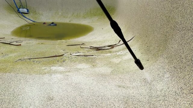 High Pressure Water Blast Cleaning Dirty Concrete Swimming Pool Surface