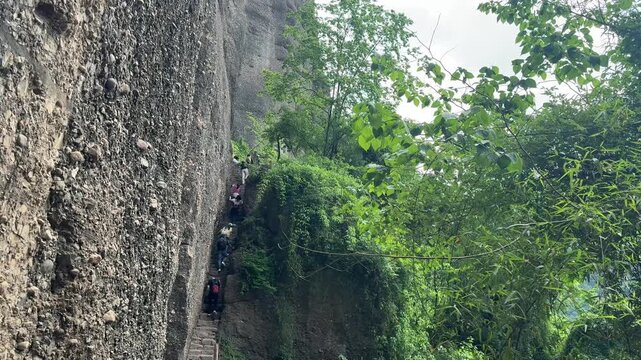 Tourists Climbing Steep Stone Steps on Cliff Path at Jianmen Pass, Sichuan