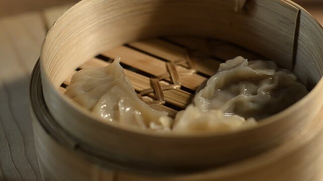 Steamed gyoza dumplings in bamboo steamer