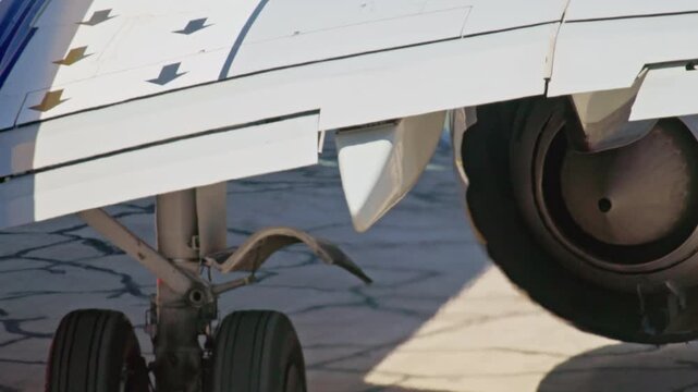 Passenger aircraft turbine close up on runway showing jet engine detail during taxiing airport operations fast reliable passenger flights and modern aviation travel