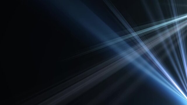Abstract blue spotlight beams glowing on black background.