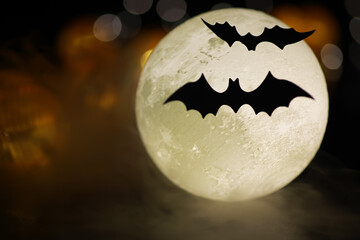 Obraz premium Halloween Full Moon with Flying Bats Silhouette on Spooky Night Background