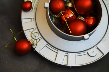 Obraz premium Festive Red Christmas Ornaments in Silver Tray for Holiday Decor and Seasonal Cheer