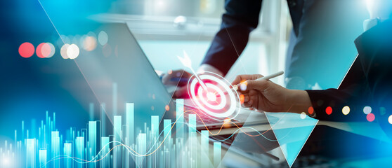 Business team selecting target icon and strategy dashboard.Goal setting and strategic focus using digital interface.strategic planning, performance tracking and digital business management for success © Zerofukuman