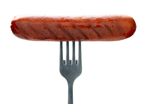 Appetizing sausage on a fork, isolated on white background