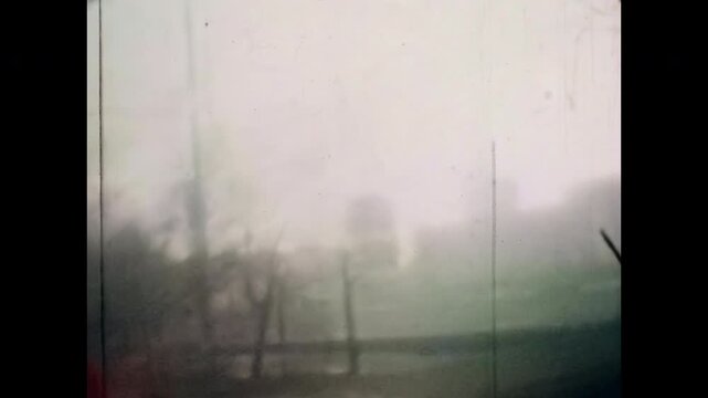 Old film, Abstract foggy cityscape in autumn city, wide view. Dreamy, fuzzy silhouettes of houses and trees. Mysterious urban landscape in thick haze. Moody, atmospheric. Muted colors in morning