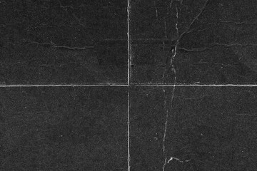 Fototapeta premium Vintage paper surface displaying rough grain, distressed imperfections, and dark texture effects.