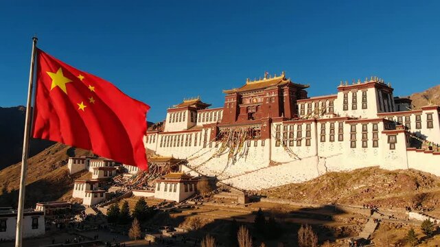 Waving chinese national flag with iconic potala palace in lhasa, tibet cultural landmark and travel destination