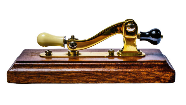 Antique brass telegraph key with wooden base and ivory and black knobs