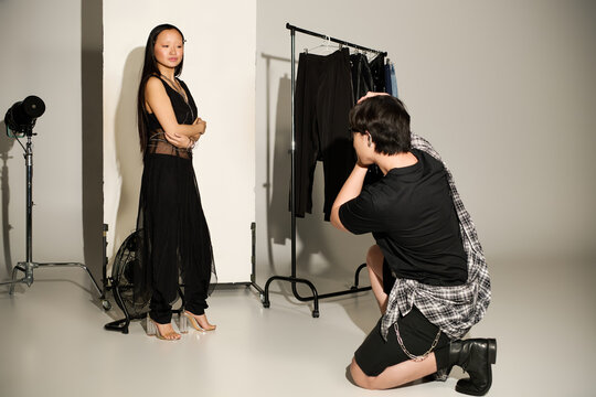Capturing a moment of creativity in a vibrant backstage setting with a stunning model