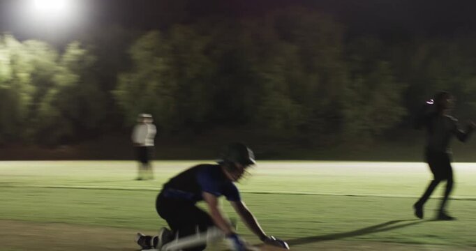 Male batsman after fast ball sprinting diving into crease for quick run on pitch