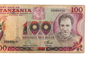 Fototapeta premium Tanzanian 100 Shillings banknote issued in 1977 reflecting Tanzania’s economic progress through detailed artwork official symbols and advanced security features