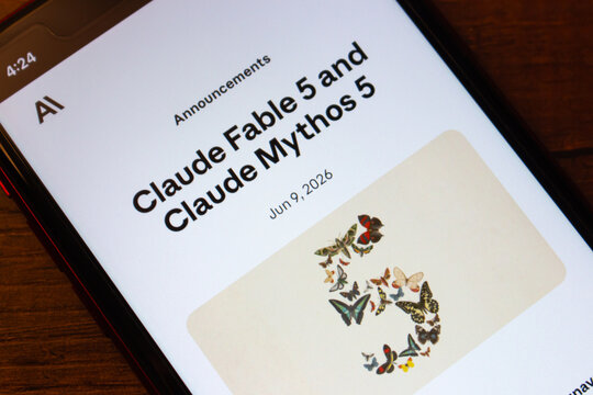 Mexico City, MEXICO - Jun 16 2026 : Smartphone displaying an announcement for Anthropic Claude Fable 5 and Claude Mythos 5, with a butterfly composition forming the number five.