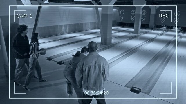 Diverse young adults playing bowling and celebrating strike captured on security camera. Ideal for surveillance system advertisements or recreational facility promos