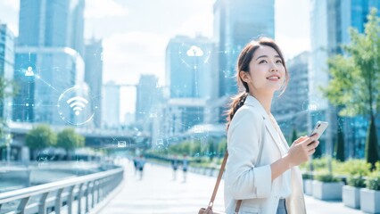 Fototapeta premium Asian businesswoman in a city holding a smartphone with digital network overlays, illustrating mobile connectivity, cloud data, and internet connection