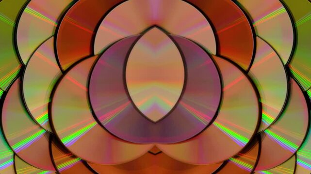 Rainbow light reflecting of a surface of a rotating CD-DVD disk against a dark background, highlight their reflective surfaces in different ways