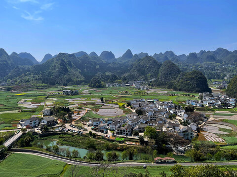 A small rural village amidst the stunning scenery of Wanfenglin (Forest of Ten Thousand Peaks) national park in Xingyi, Guizhou, China