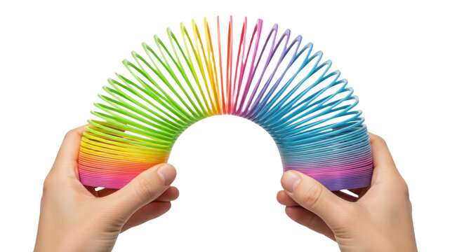 Hands stretching a colorful rainbow plastic spring toy in an arc shape